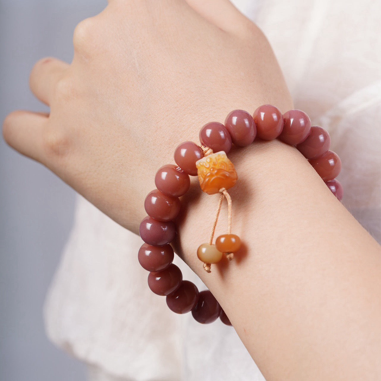 Smoky Pink Bodhi Bead Bracelet with Roaring Lion Pendant