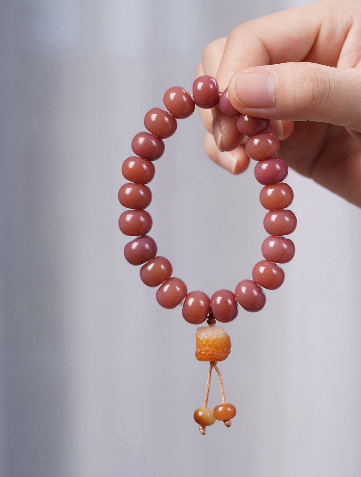 Smoky Pink Bodhi Bead Bracelet with Roaring Lion Pendant