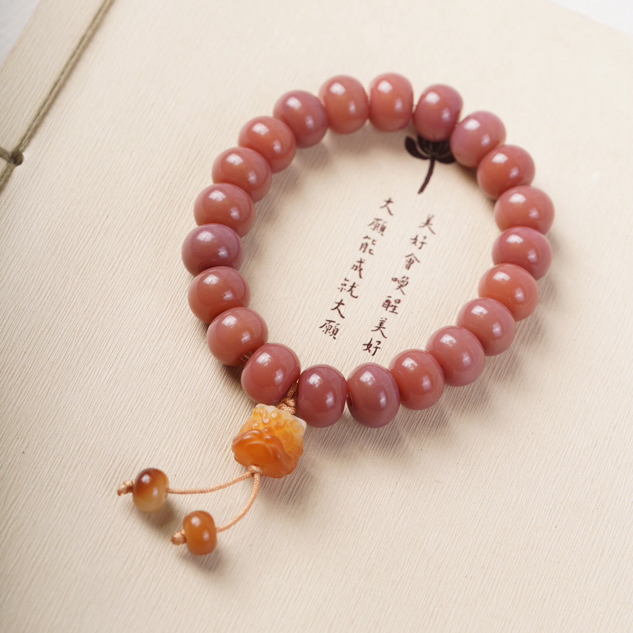 Smoky Pink Bodhi Bead Bracelet with Roaring Lion Pendant