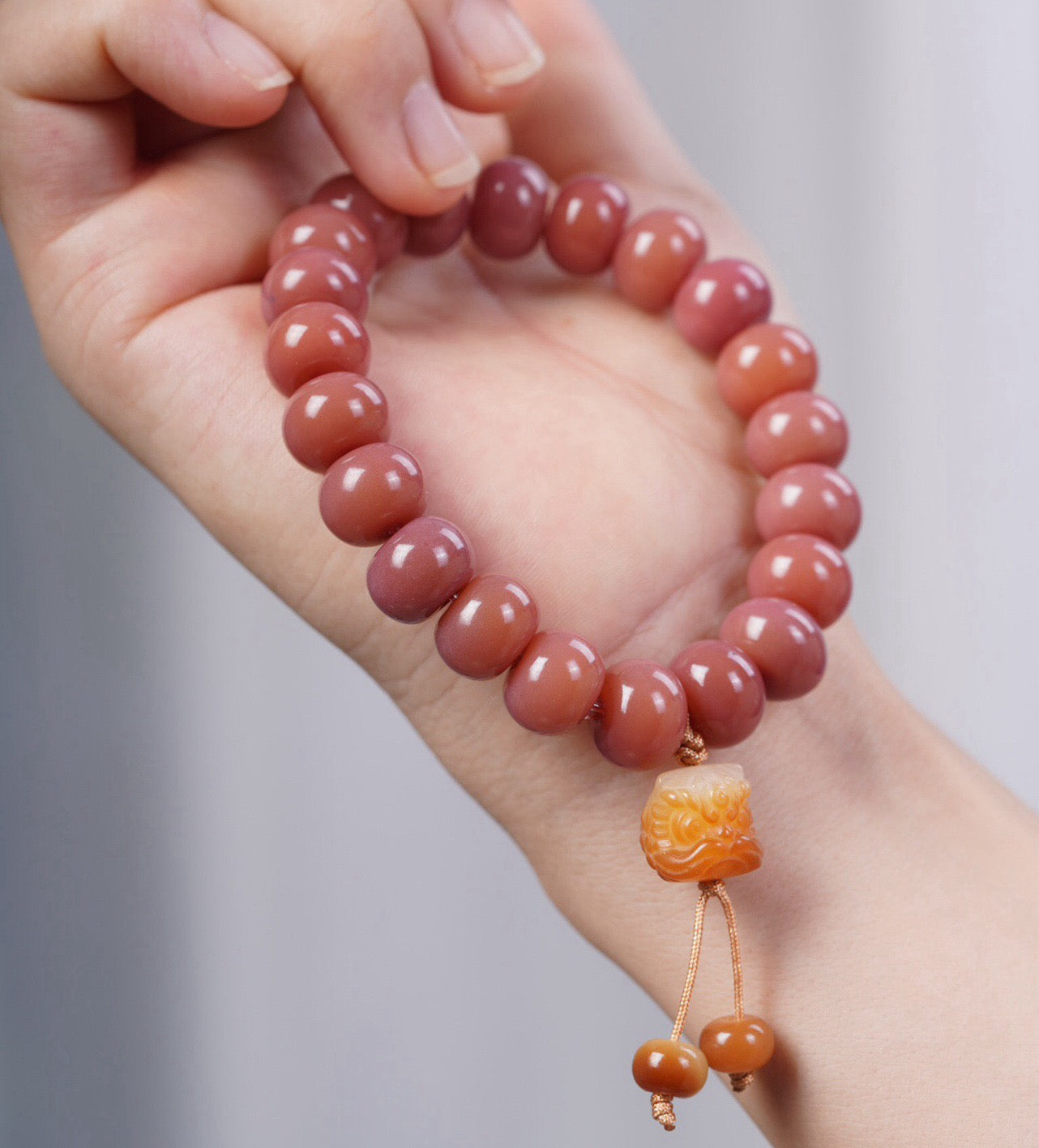 Smoky Pink Bodhi Bead Bracelet with Roaring Lion Pendant