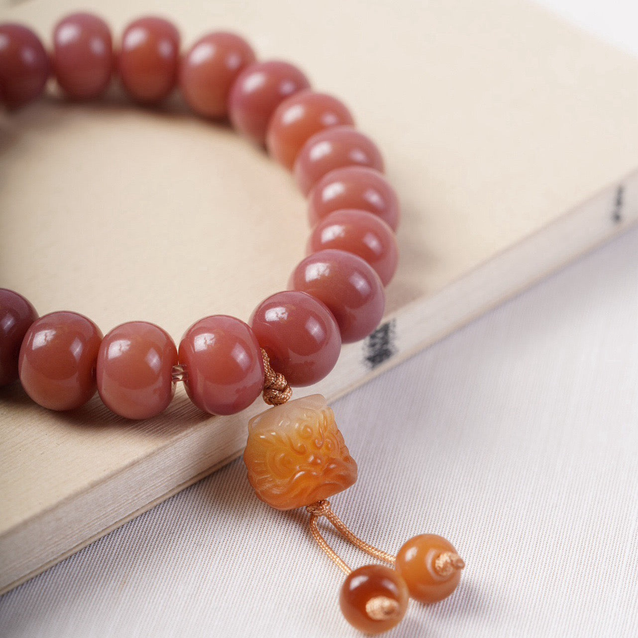 Smoky Pink Bodhi Bead Bracelet with Roaring Lion Pendant